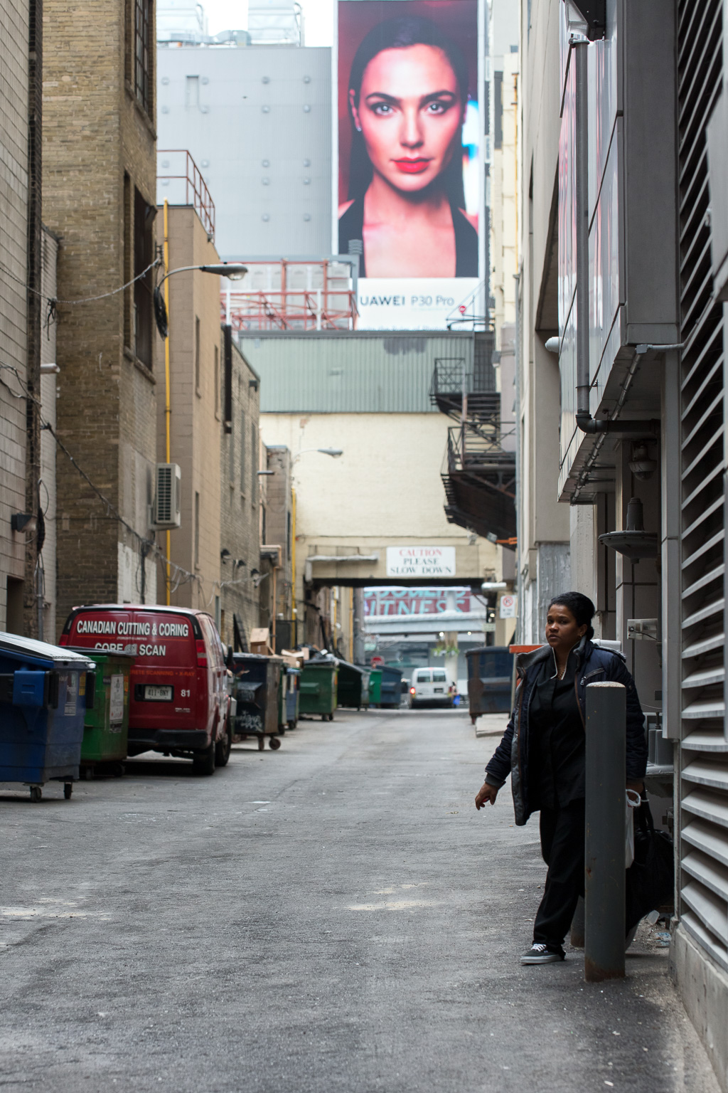 Huawei advertisement overlooks O'Keefe Lane in downtown Toronto.