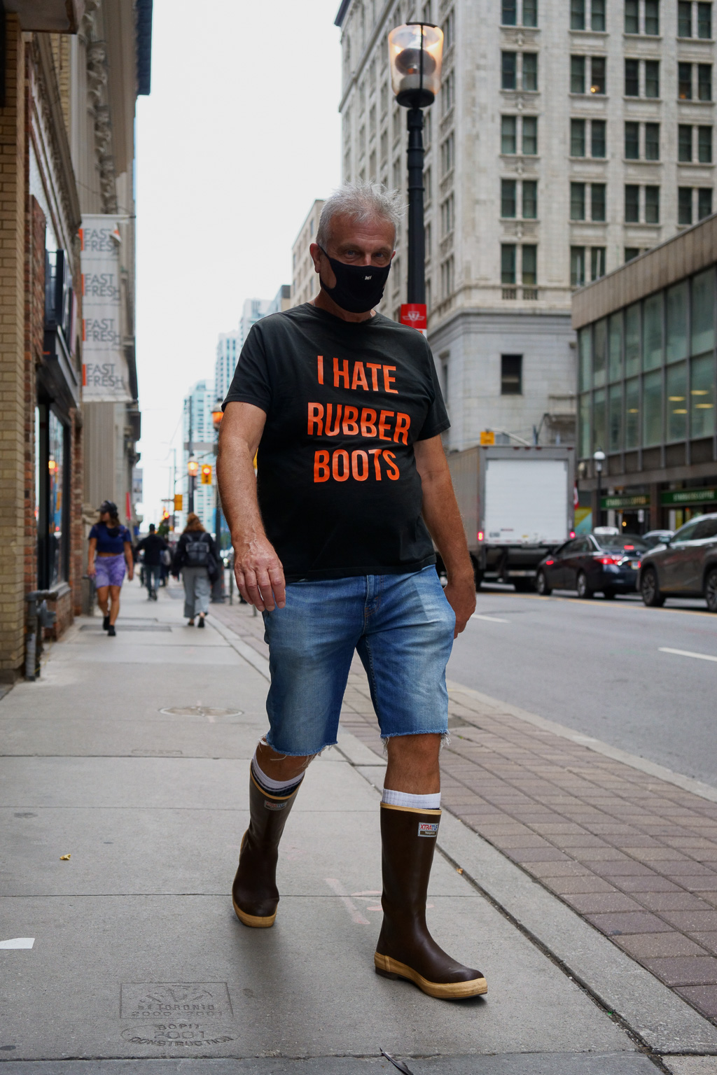 Walking up Yonge Street in Rubber Boots wearing a T-shirt that reads: "I hate rubber boots."
