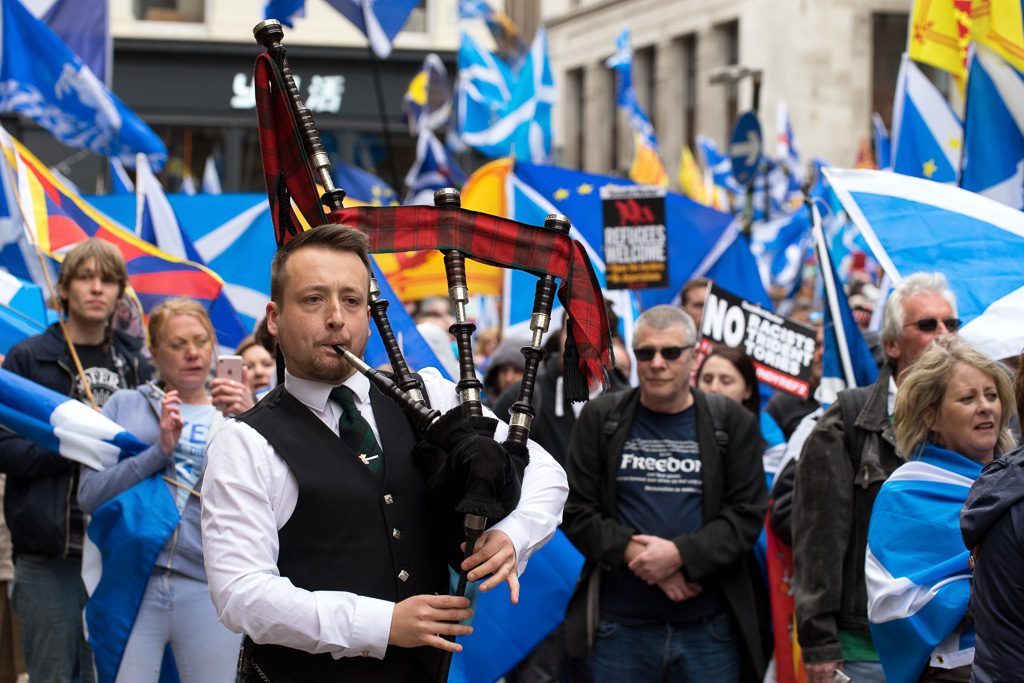 Piper marches through Nelson Mandela Square in Glasgow during an All Under One Banner (AUOB) protest.