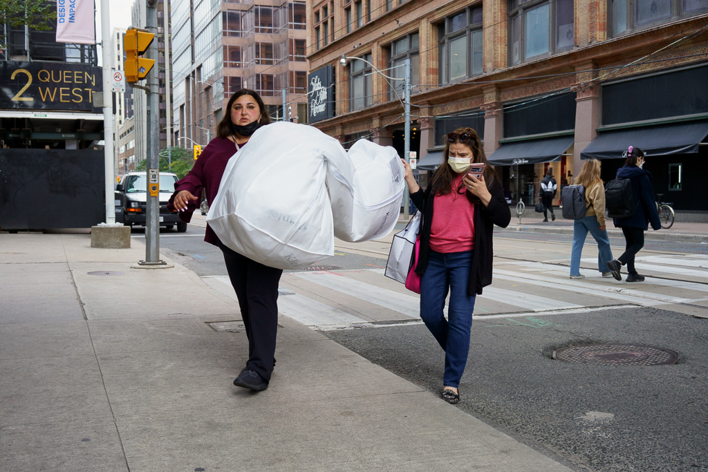 Mother & Daughter carry wedding dress across Queen Street West, Toronto