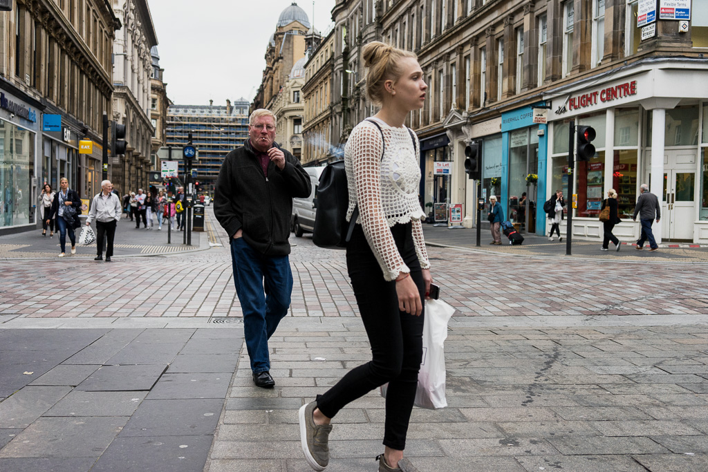 Pedestrians at the intersection of Mitchell and Gordon Streets in Glasgow