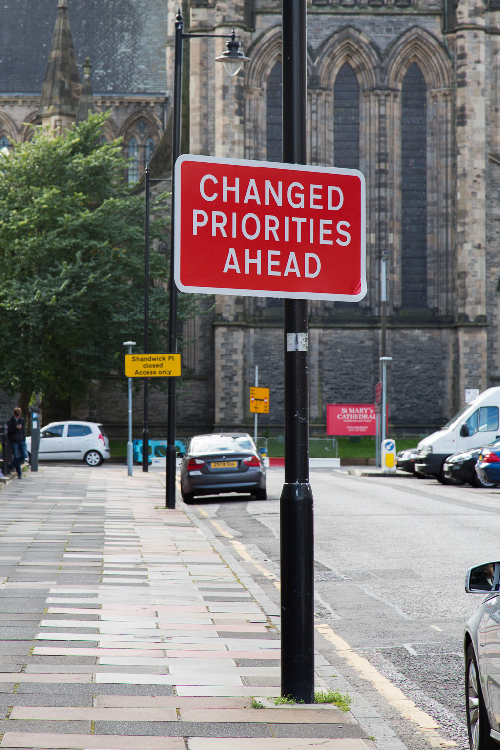 "Changed Priorities Ahead" sign in front of St. Mary's Cathedral, Edinburgh