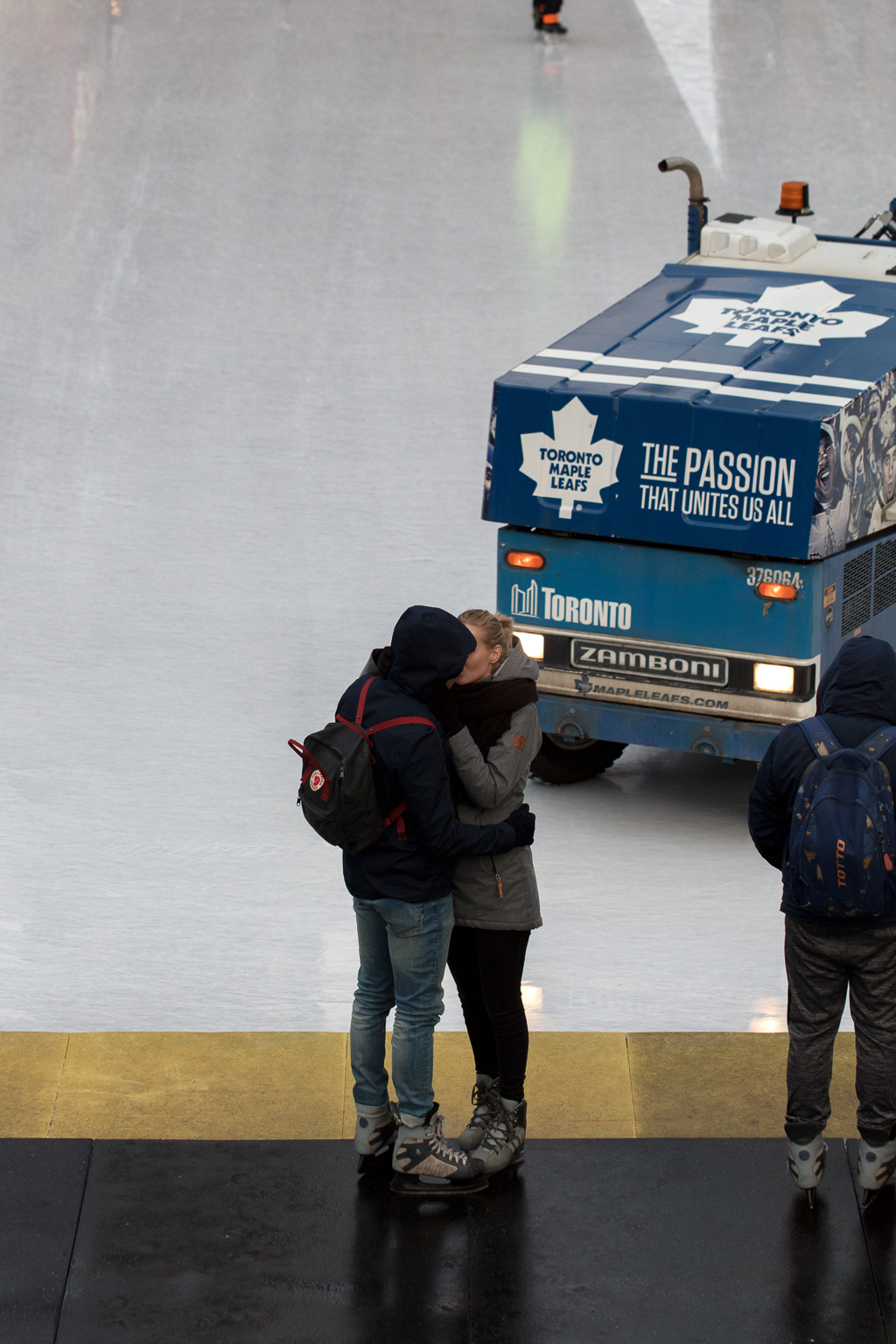 Couple kissing at Nathan Phillips Square