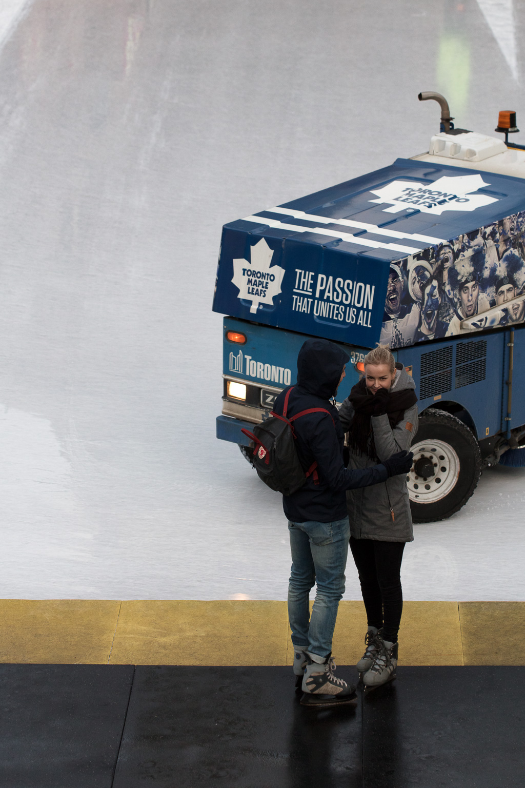 Couple kissing at Nathan Phillips Square