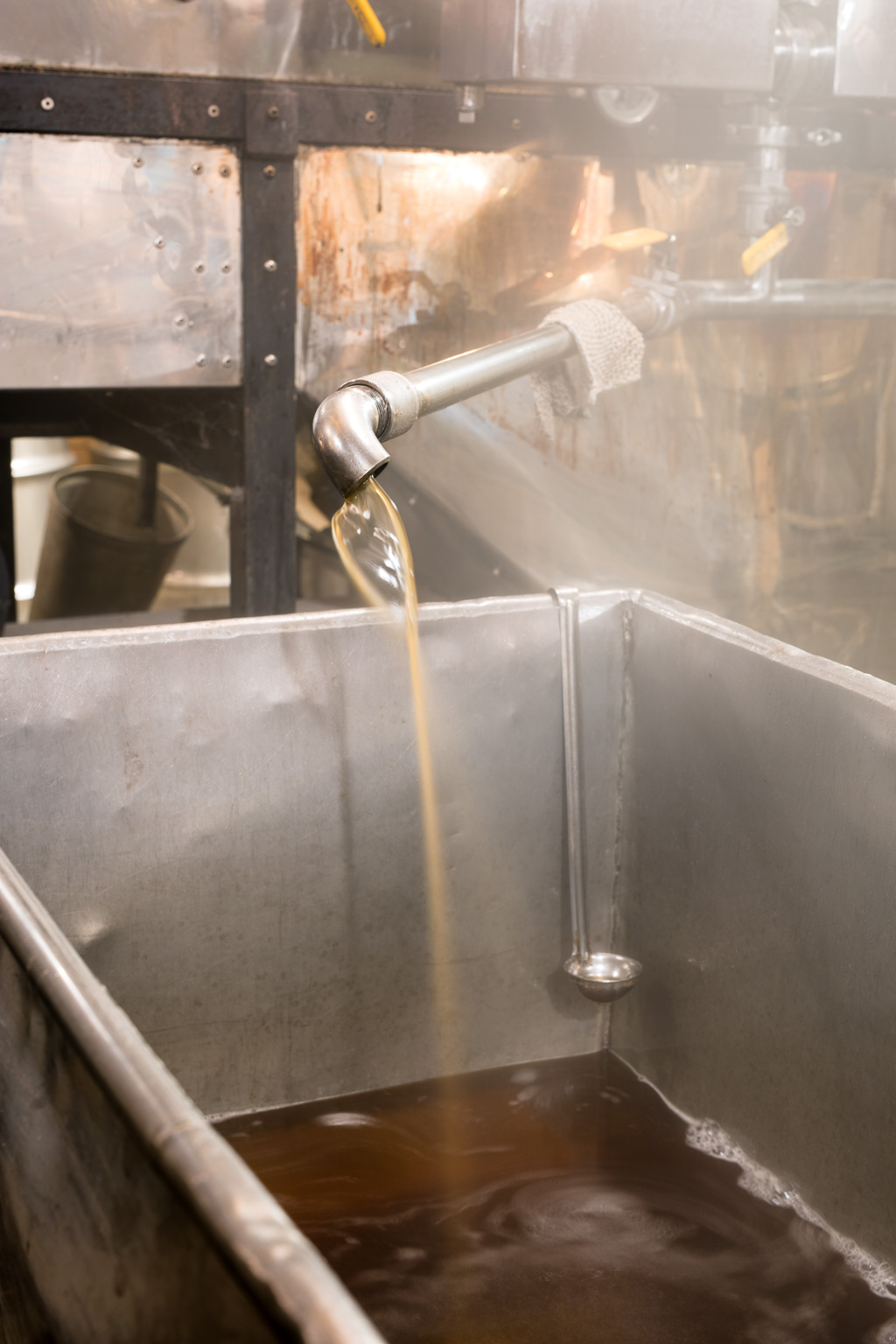 Maple syrup pouring from the evaporator.